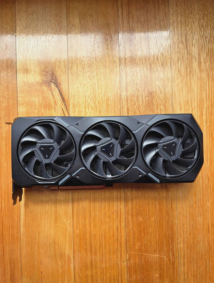 Representative AMD Radeon RX 7900 XT reference-design board physical card, photographed from the front