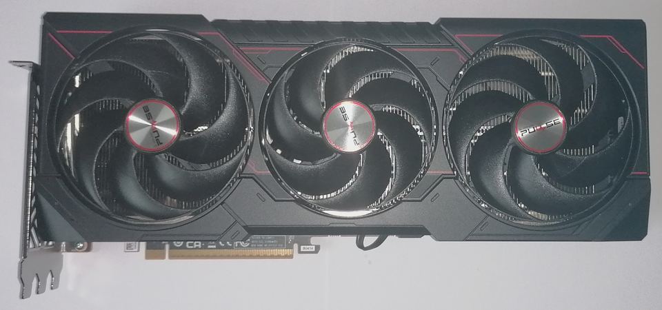 Representative Sapphire Pulse Radeon RX 9070 XT board physical card, photographed from the front