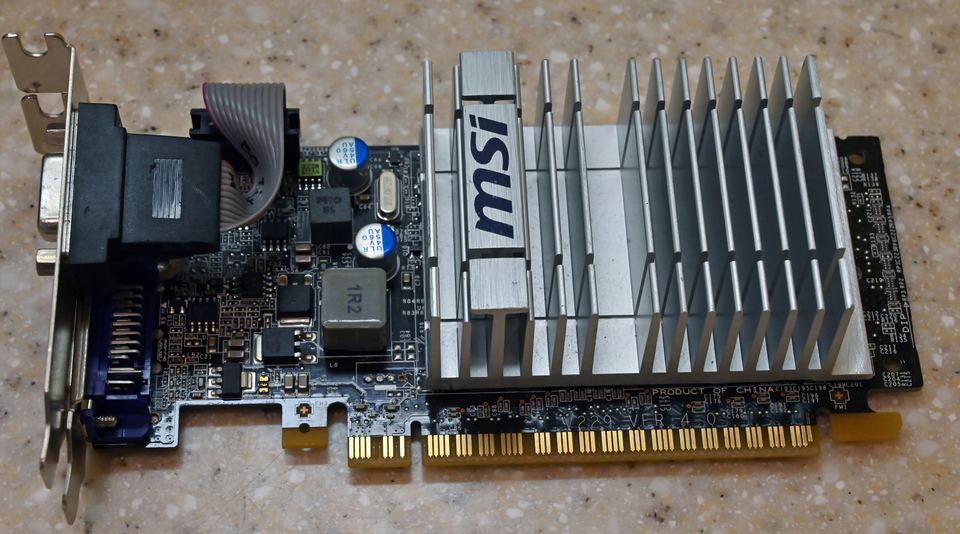 Representative MSI GeForce 210 low-profile PCIe board physical card, photographed from the front