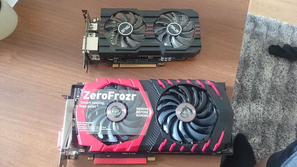 Representative ASUS GeForce GTX 660 beside an MSI GeForce GTX 1070 Gaming X physical card, photographed from the front