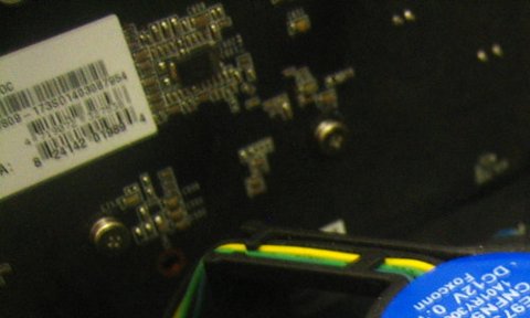 Representative GeForce GTX 750 Ti OC partial rear PCB in a desktop PC physical card, photographed from the front
