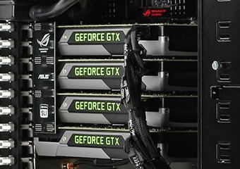 Representative Four GeForce GTX TITAN Black cards installed in an AVADirect PC physical card, photographed from the front