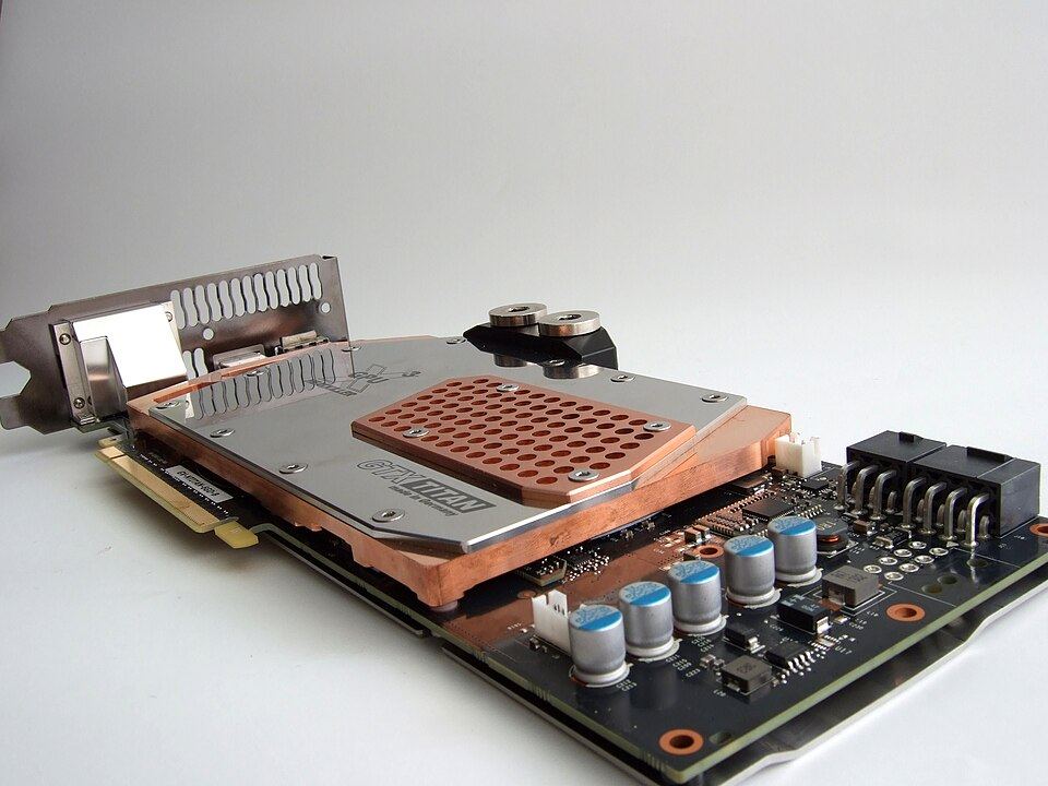 Representative GeForce GTX TITAN with a custom water block physical card, photographed from the front