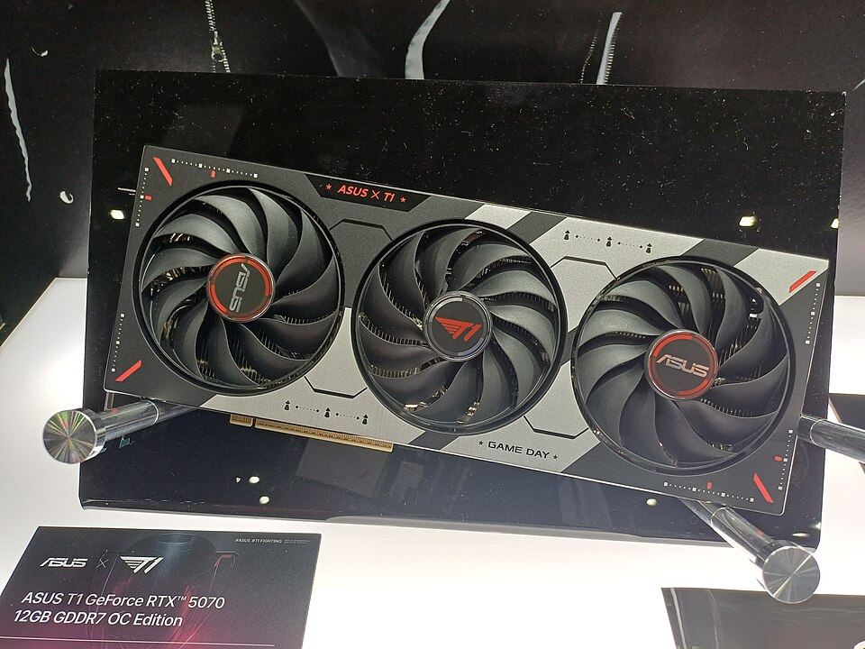 Representative ASUS TUF GeForce RTX 5070 12 GB GDDR7 OC exhibition board physical card, photographed from the front
