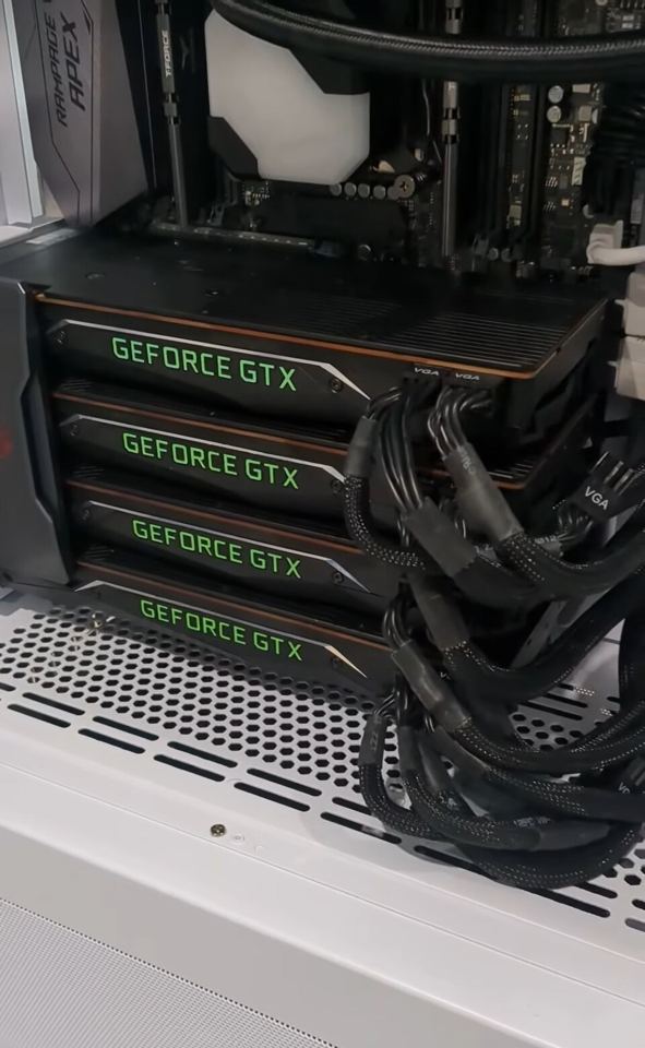 Representative Four GeForce TITAN Xp cards installed in a PC physical card, photographed from the front
